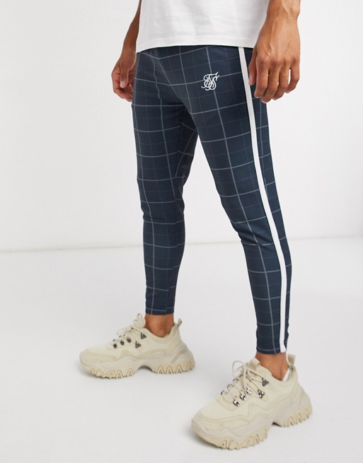 Siksilk checked tapered joggers with side panel stripe in navy