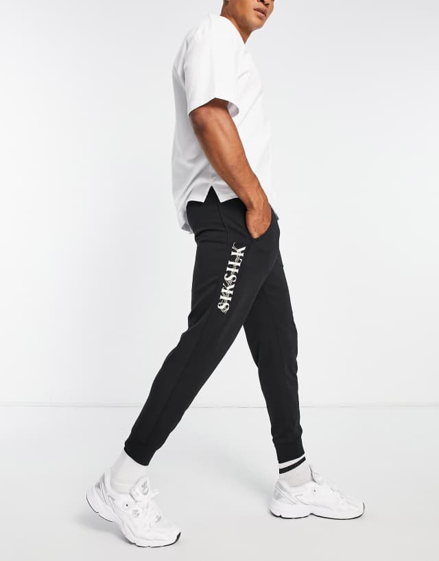 Siksilk jersey sweatpants in black with side leg print - part of a set