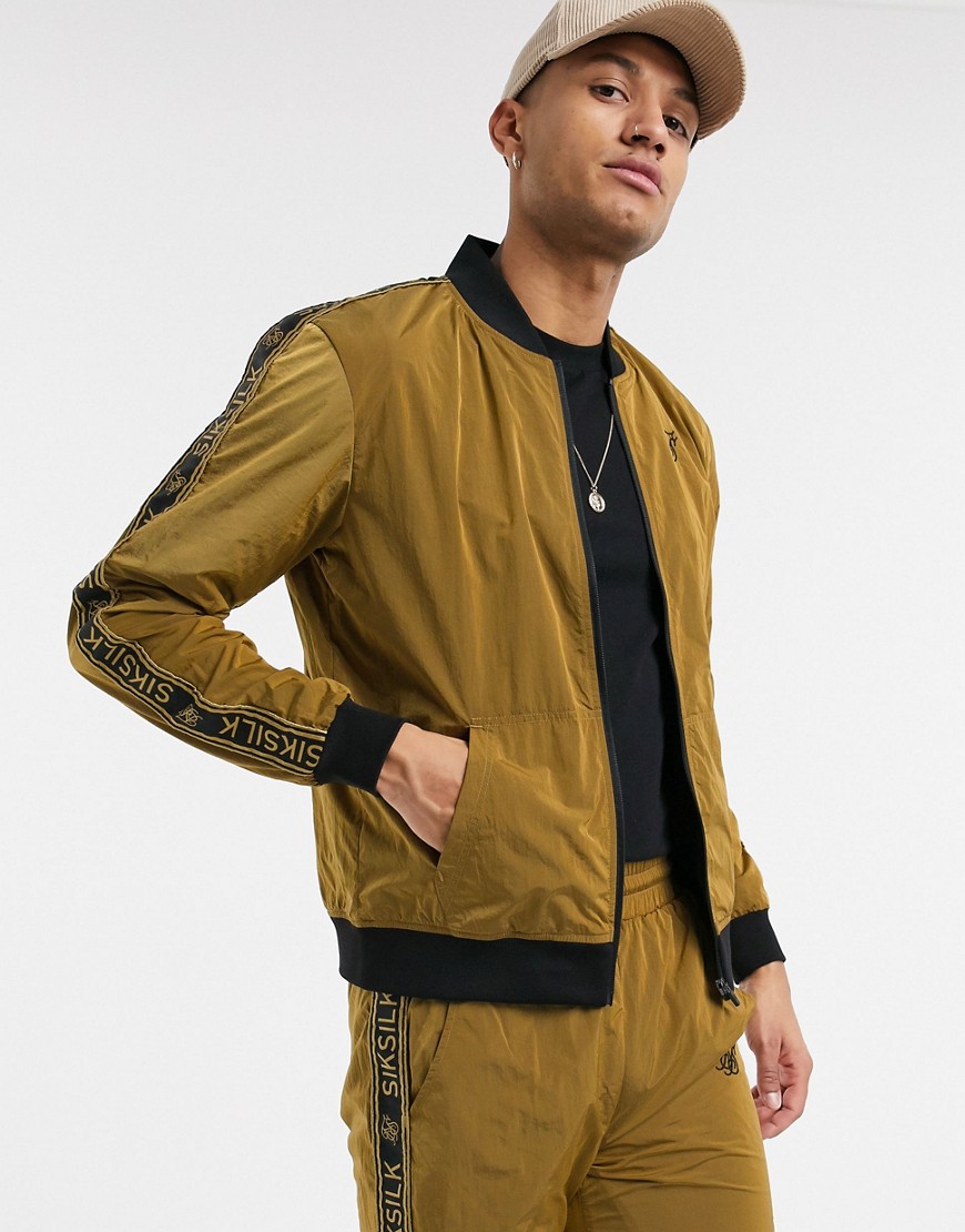 SikSilk nylon track top in gold with logo side stripe