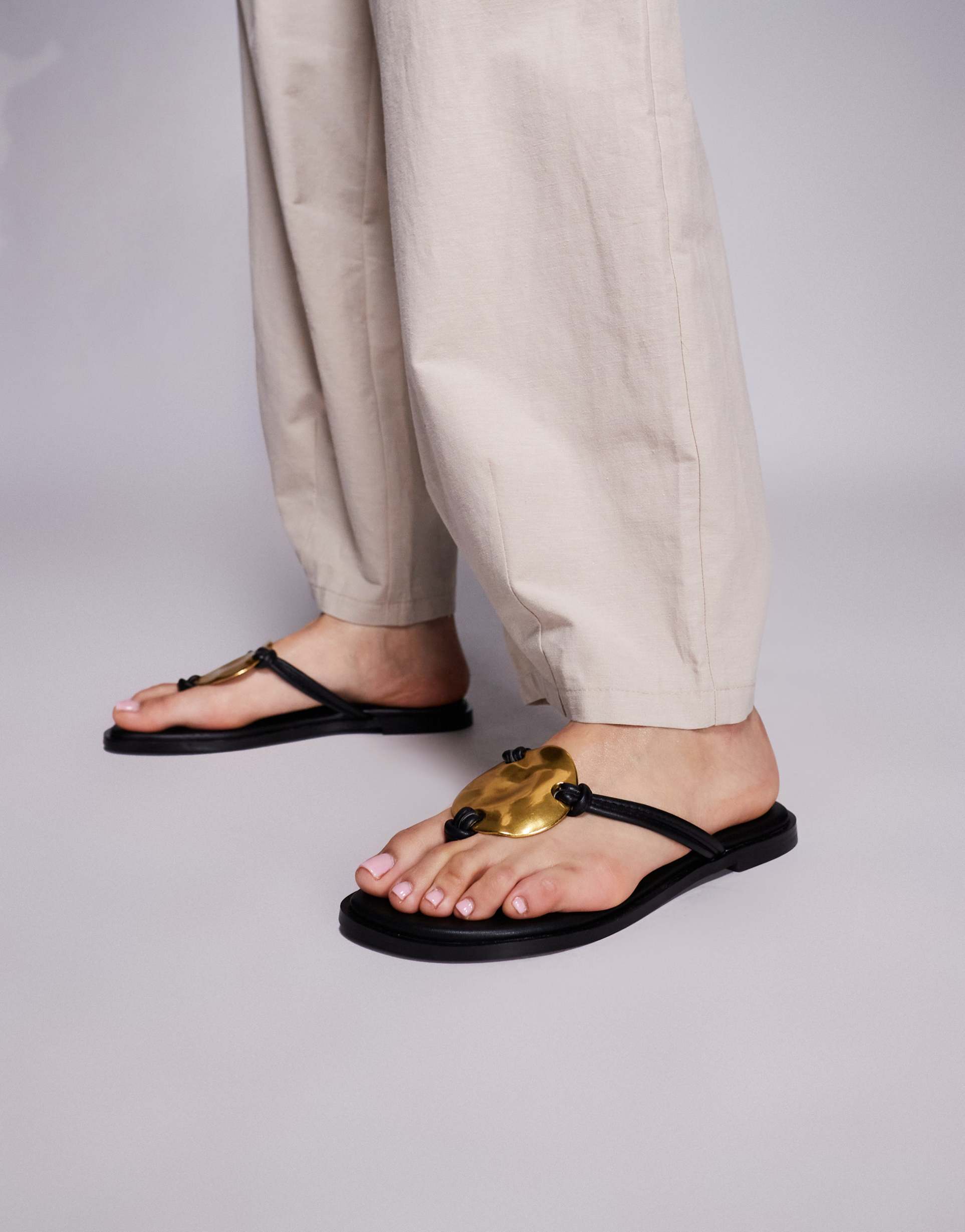 simmi london bowe toe thong sandals with gold metal detail in black