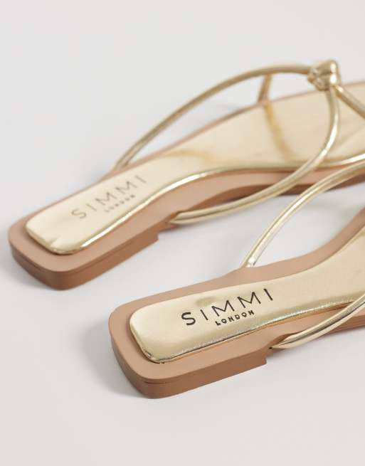 SIMMI London – Cola – Guldfärgade platta sandaler med knut, 4 av 4