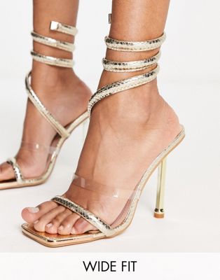Simmi London Wide Fit Eloise heeled sandals with leg wrap in gold  - ASOS Price Checker