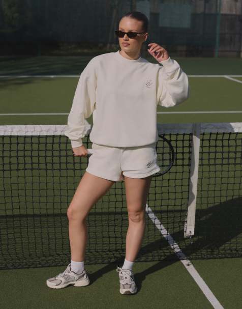 Simmi London Embroidered logo jersey shorts in cream