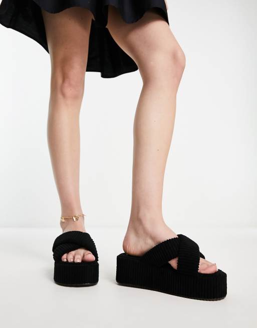 SIMMI London - Mohala - Sorte plateau-slides med krydsede stropper i frotté 