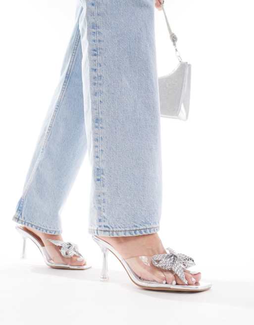 Simmi London - Pointure large - Ashleigh - Mules à talon mi-haut transparent et nœud ornementé - Argenté