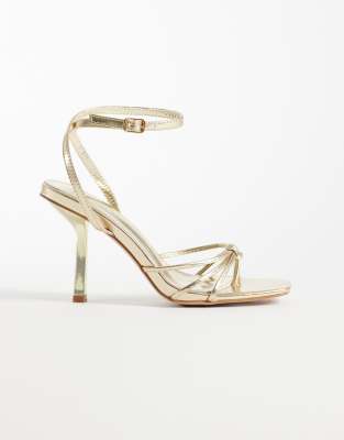 SIMMI London – Sabrina – Riemchen-Sandaletten in Metallic-Gold