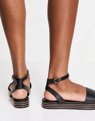 black studded flatforms