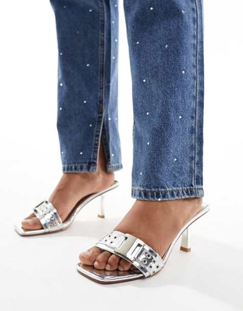 Simmi London Wide Fit Bexley mid heeled mules with grommet buckle detail in silver - view 1