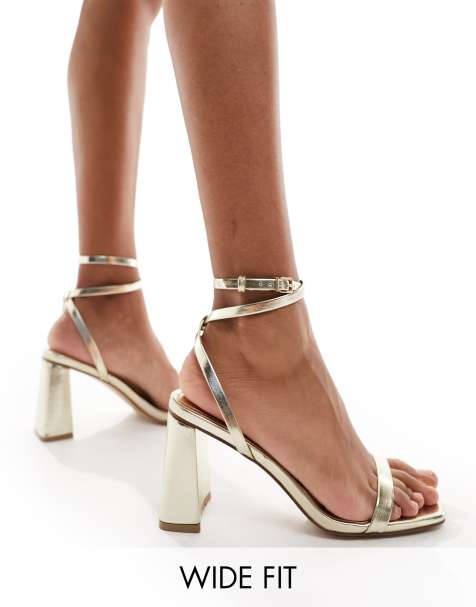 ASOS DESIGN Hitched bow detail mid block heeled sandals in gold