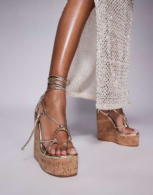 Simmi London Wide Fit Jadey strappy high heel wedges in gold