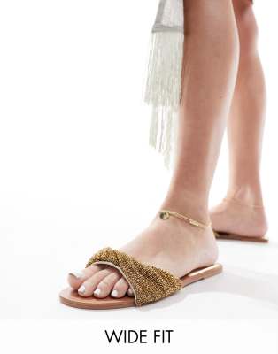 Simmi London Wide Fit - Kenya - Flache Sandalen in Gold mit verziertem Riemchen-Goldfarben