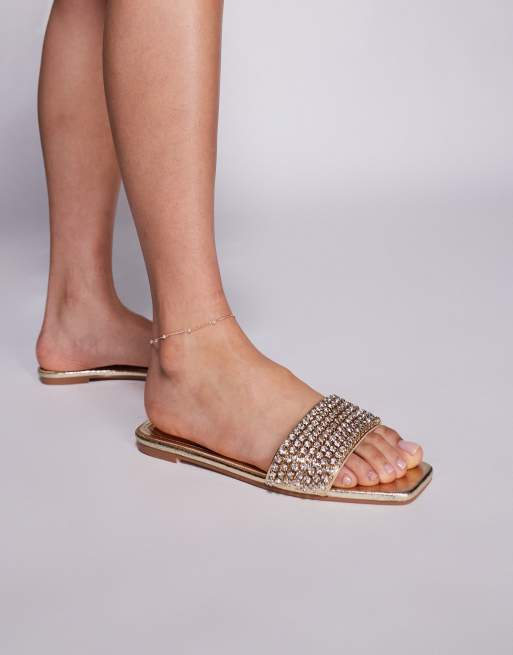 Simmi London Wide Fit – Paison – Złote metaliczne płaskie sandały z diamencikami