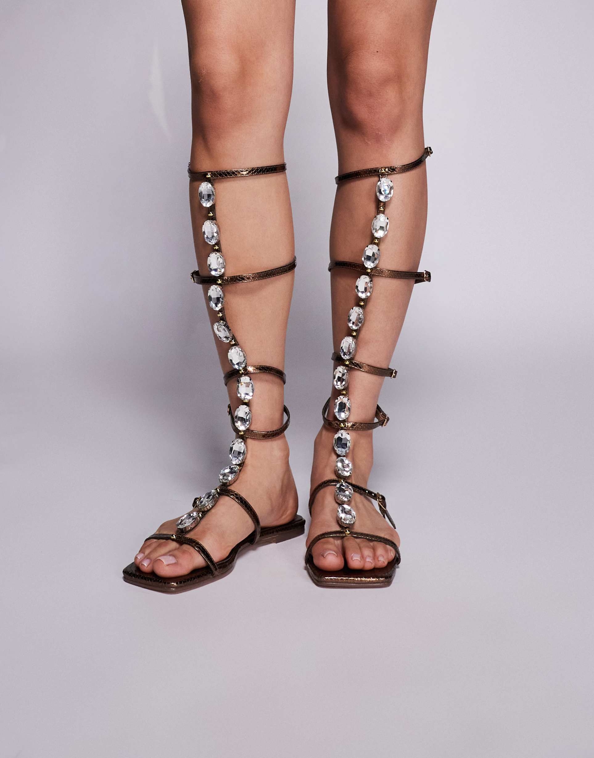 simmi london zenya gladiator sandals with stone details in bronze metallic