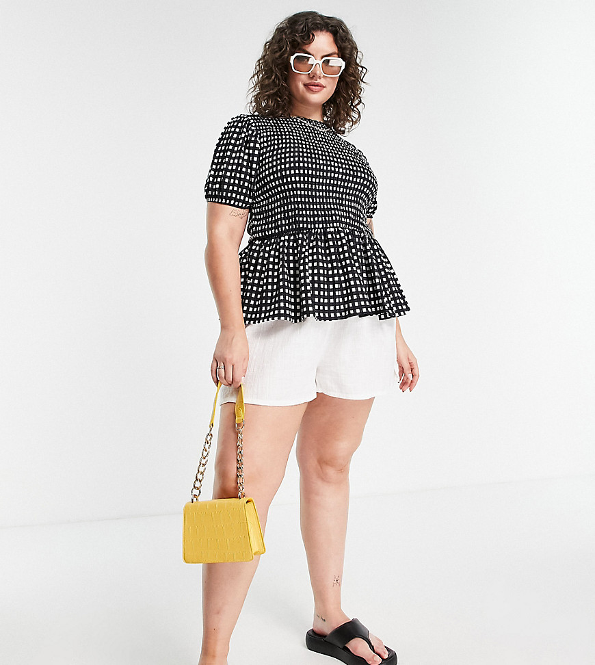 Plus-size top by Simply Be Cos your jeans deserve a nice top Gingham print Crew neck Shirred stretch bodice Short sleeves Regular fit