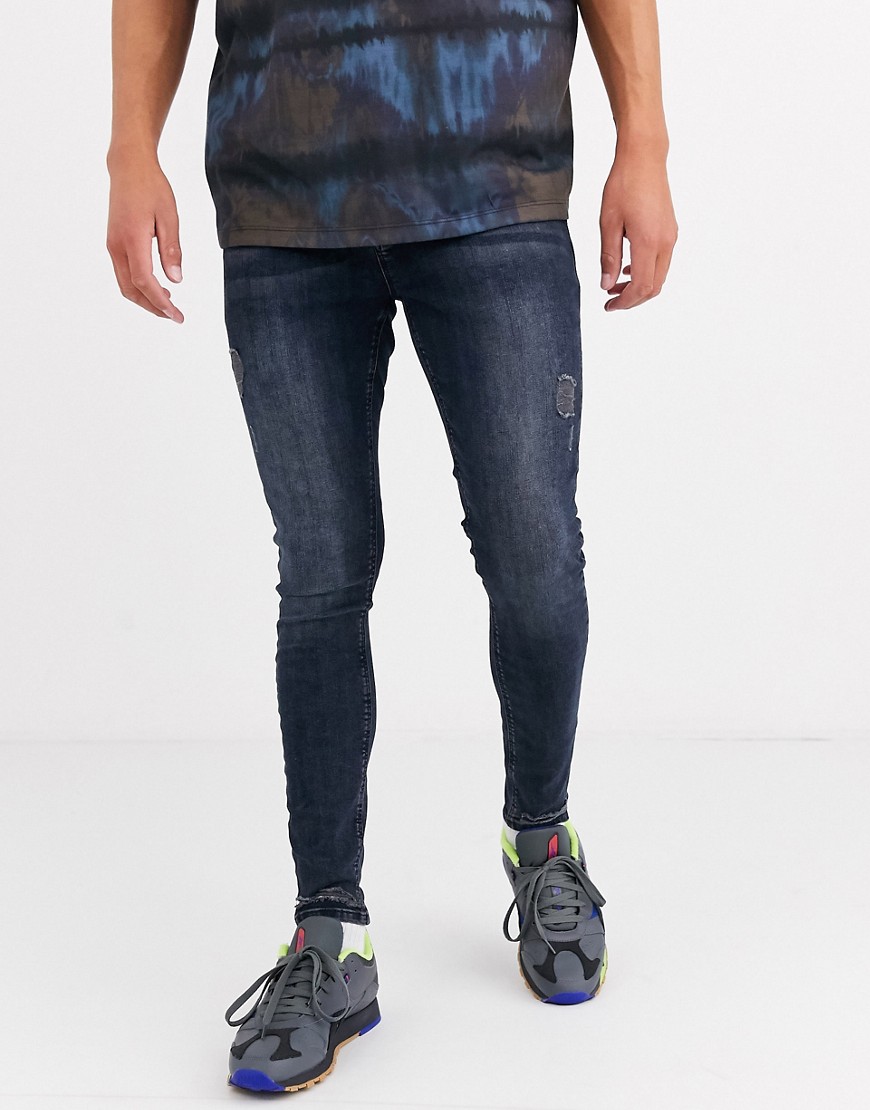 фото Сине-черные джинсы стретч с рваной отделкой asos design-синий