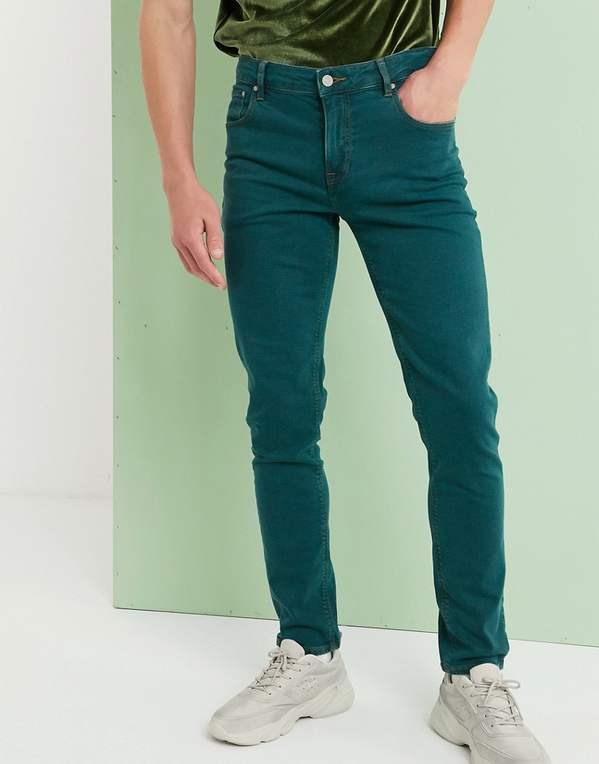 Темно зеленые джинсы