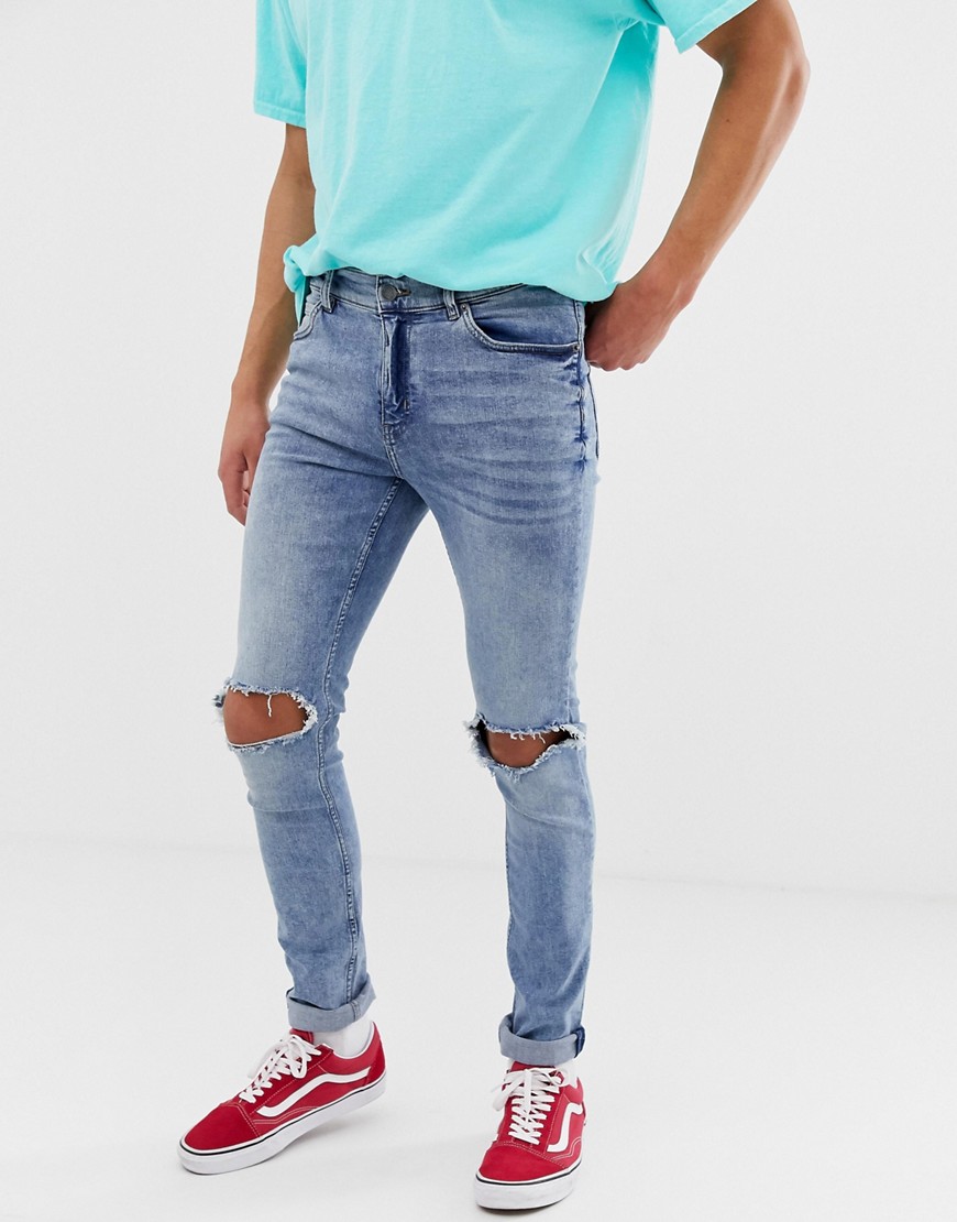 фото Синие зауженные джинсы с рваными коленями cheap monday-синий