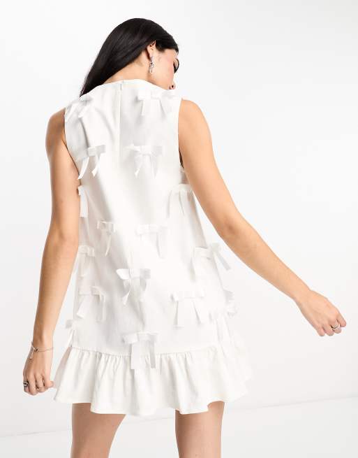 Sister Jane bow embellished ruffle hem mini dress in ivory