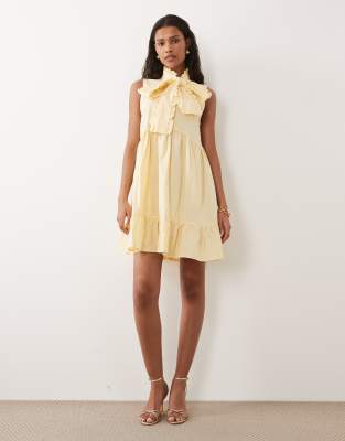 Sister Jane Buttermilk Cotton Blend Bow Detail Sleeveless Mini Dress In Yellow