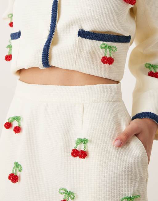 Sister Jane cherry embellished tweed mini skirt co-ord in cream, 2 of 5