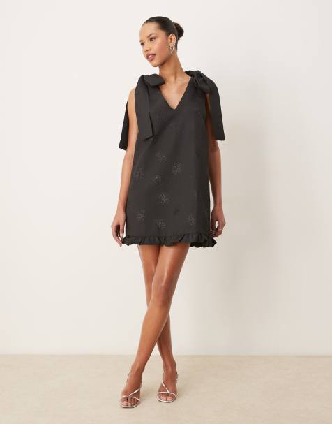 Sister Jane bow shoulder mini dress in black