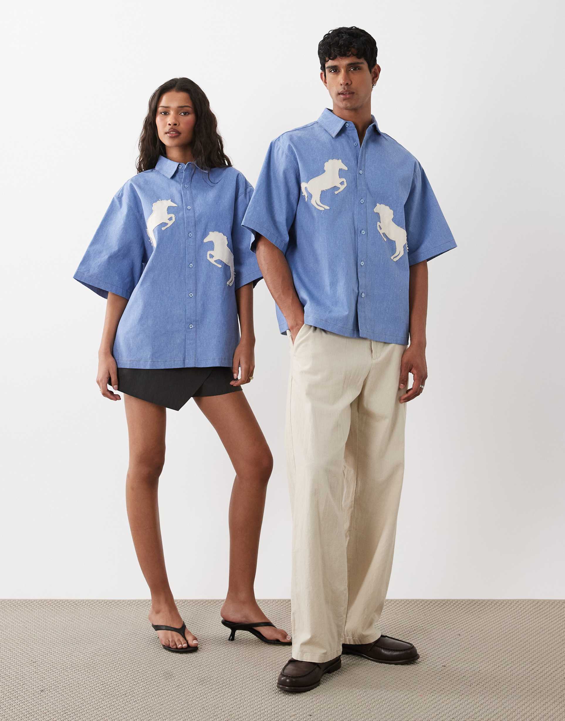 sister jane dala unisex cotton applique horse detail boxy denim shirt in mid blue