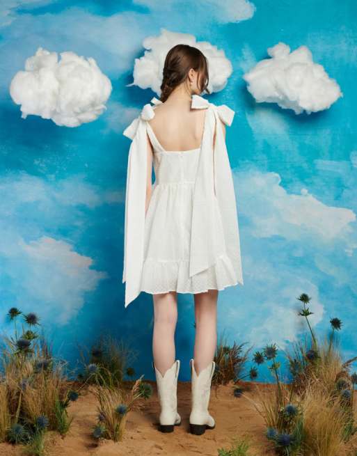 Sister Jane exaggerated bow shoulder mini dress in ivory | ASOS