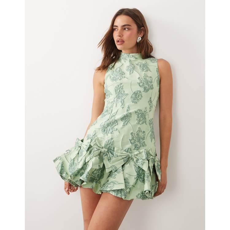 Sister Jane Exclusive jacquard sleeveless cinched waist bow hem mini dress  in light green floral | ASOS