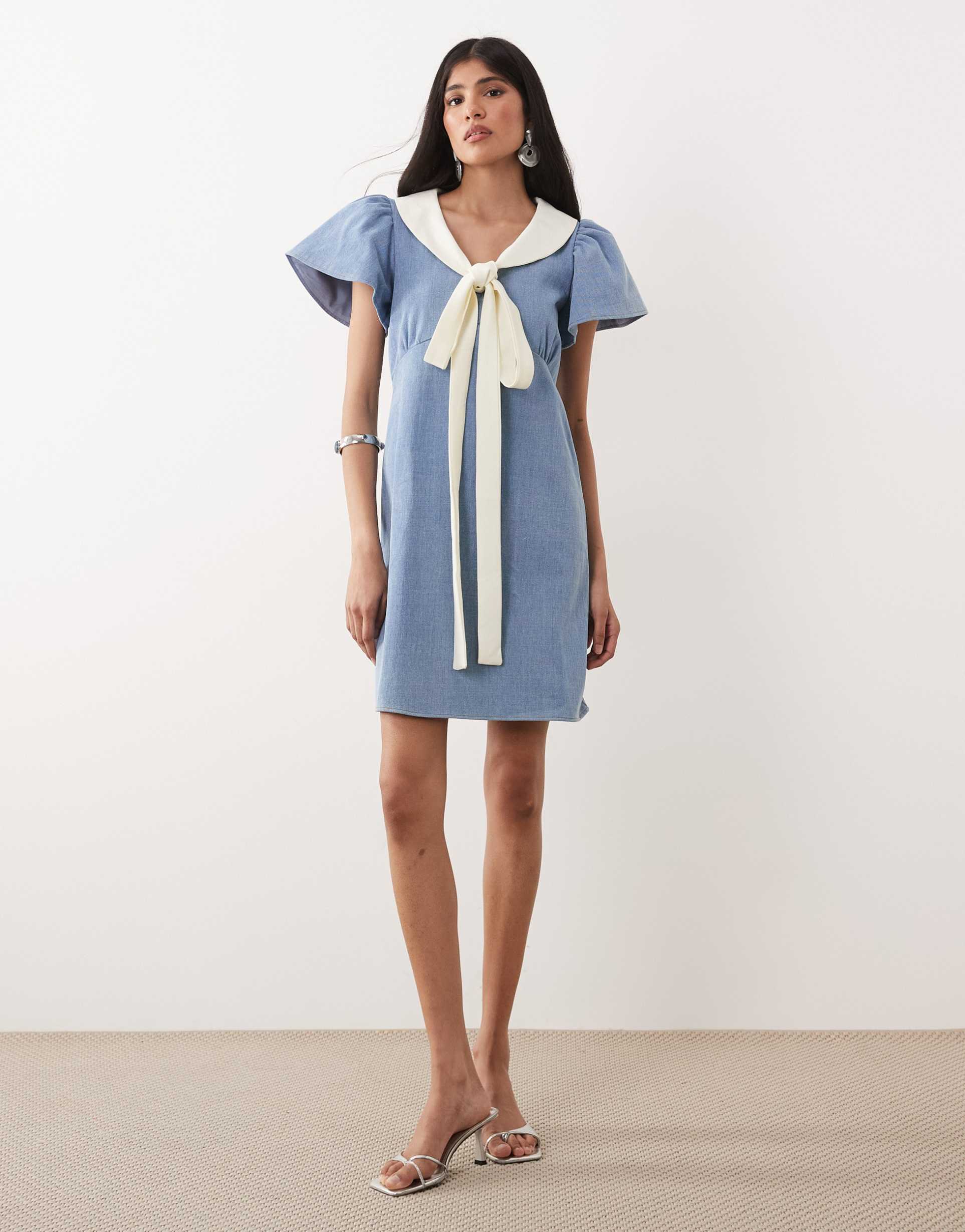 sister jane kasos denim bow detail short sleeve mini dress in light blue