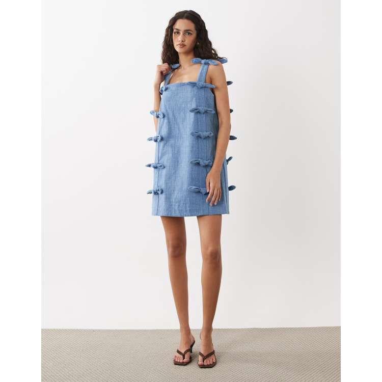 Sister Jane Larsson denim square neck bow detail mini dress in