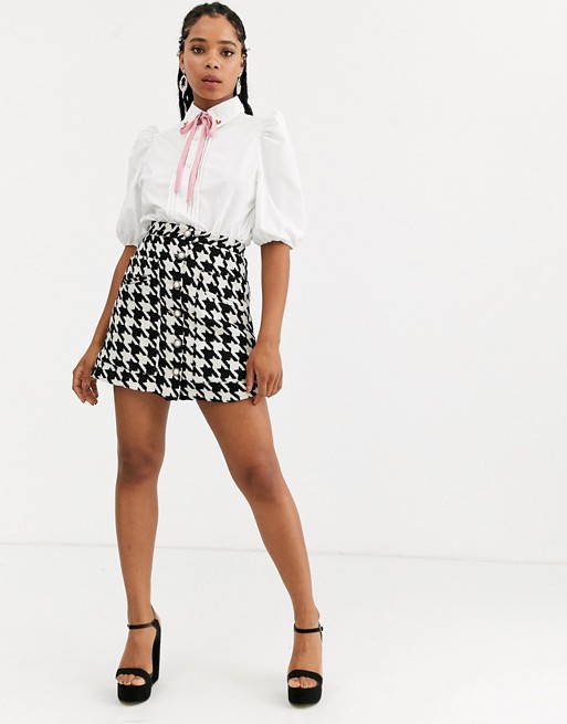 Sister Jane mini skirt with faux pearl buttons in houndstooth