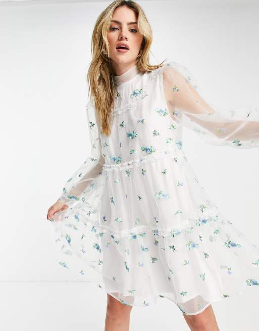 Sister Jane mini smock dress with sheer overlay and embroidered flowers in white