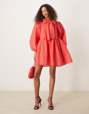 oversized bow mini dress in red-pink