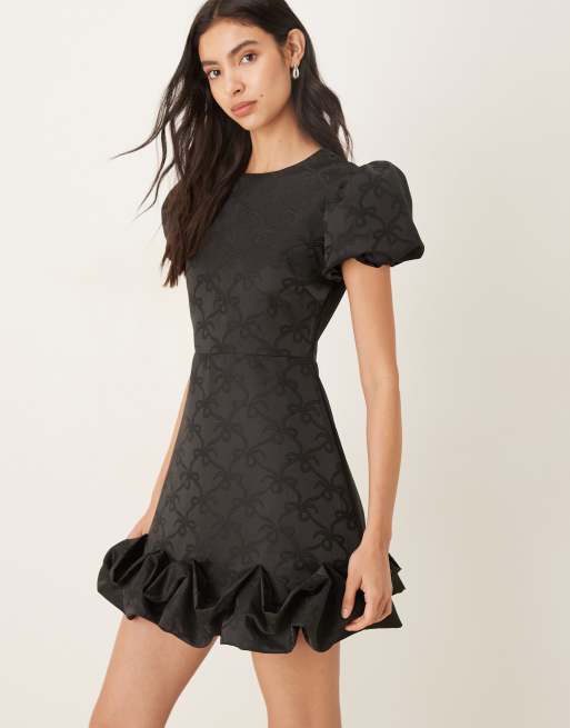 Sister Jane puff sleeve ruffle hem mini dress in black bow print, 4 of 4