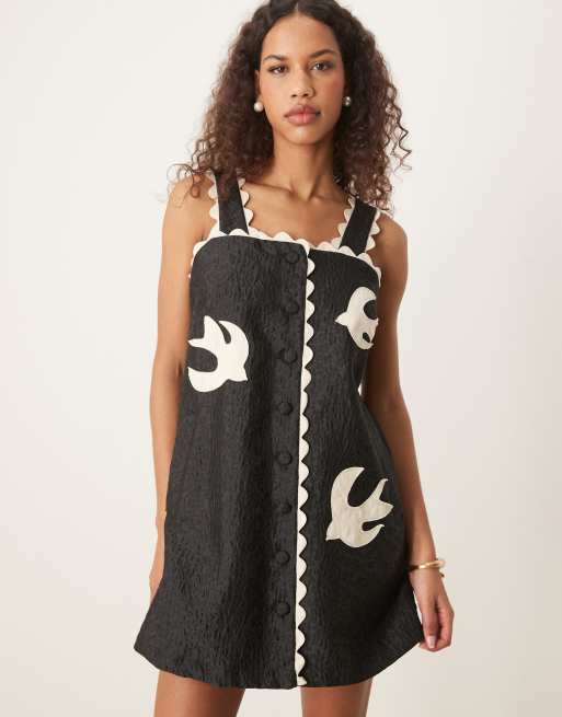 Sister Jane swallow heart embroidered mini dress in black | ASOS