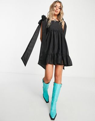 Sister Jane tiered mini dress in black with bow back straps