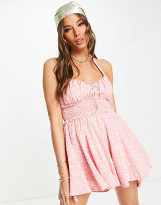 Sisters Of The Tribe halter neck playsuit with shirred waist in pink floral | ASOS