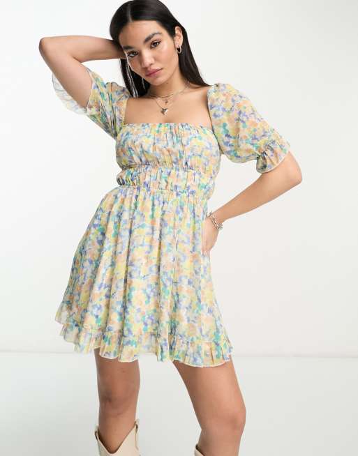 Sisters Of The Tribe mini milkmaid dress with shirred and open waist in blue ditsy floral