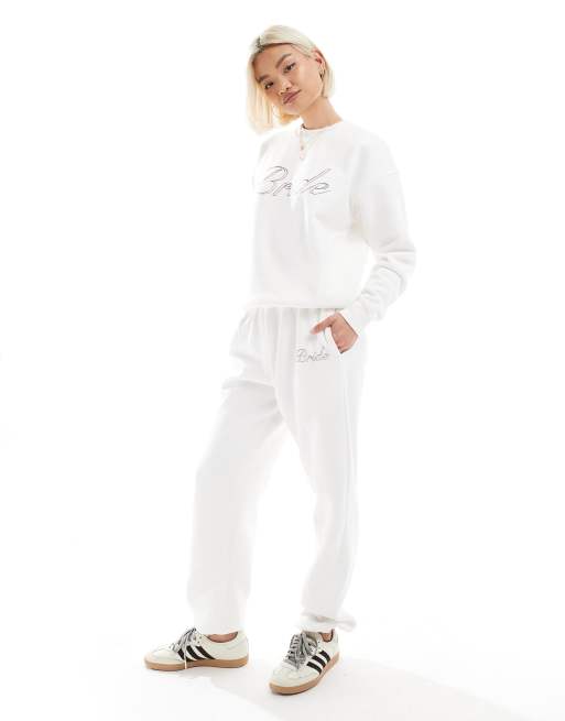 Six Stories - Joggers color avorio con scritta 