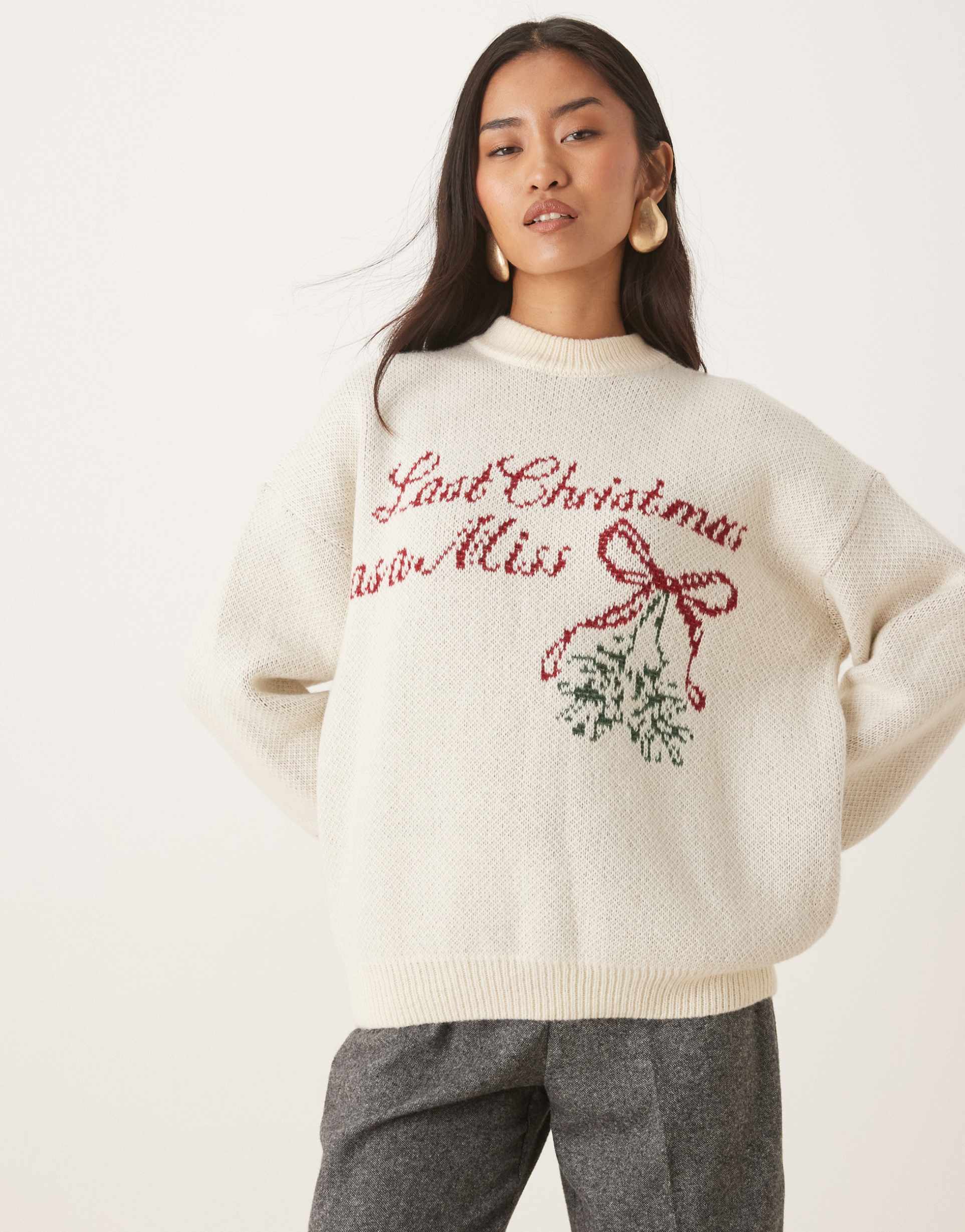 six stories last christmas as a miss knit crewneck mistletoe sweater in cream