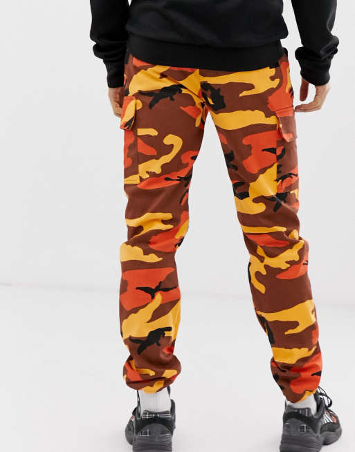 Reclaimed Vintage Revived Camo Cargo Trousers In Orange, $42, Asos