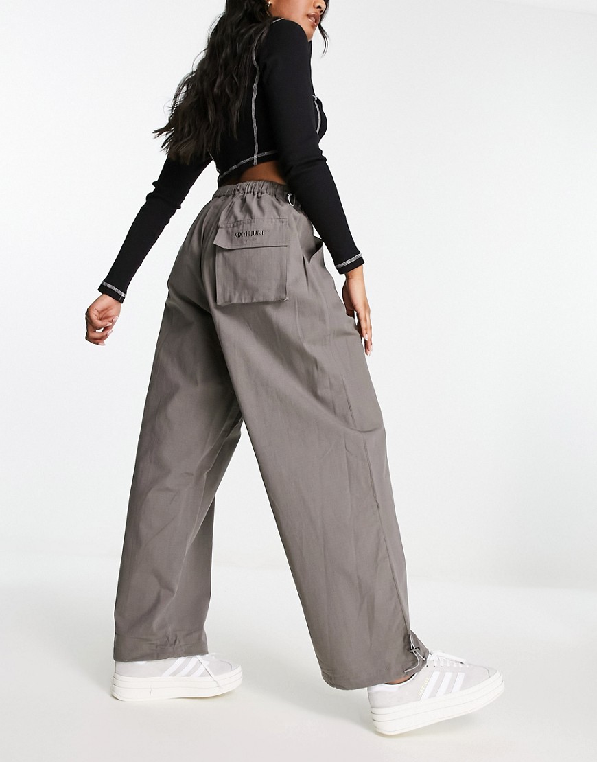 parachute pants with tonal embroidery in khaki-Green
