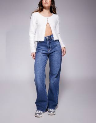 relaxed low waist denim jean with frayed hem in blue