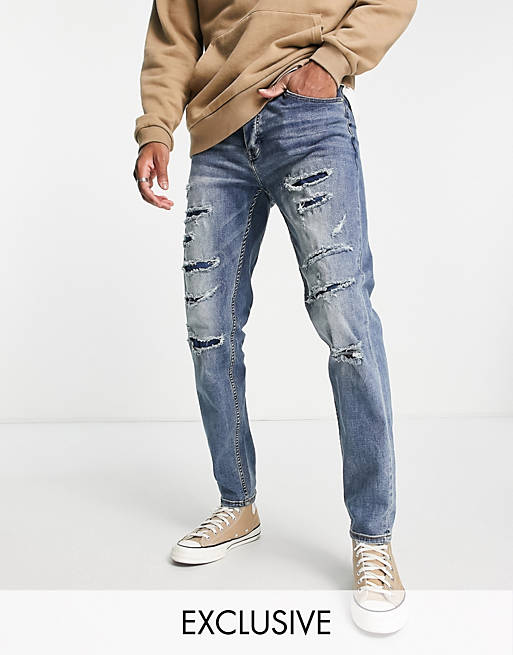 Sixth June - Ruimvallende jeans met beschadigingen in blauwe wassing, exclusief bij ASOS