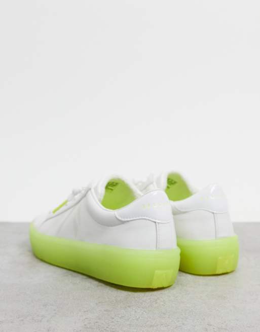 Skechers lace up sneakers in white with green sole