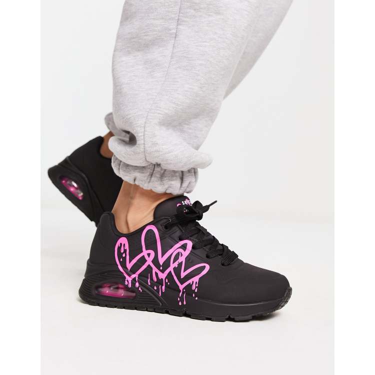 meubilair acuut Tussen Skechers Uno sneakers with neon graffiti heart print in black | ASOS