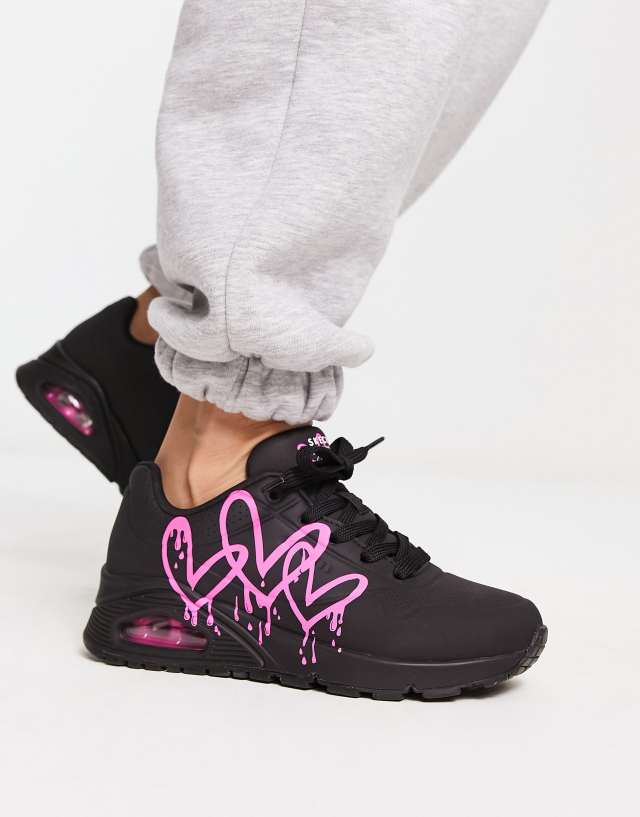 Skechers Uno sneakers with neon graffiti heart print in black