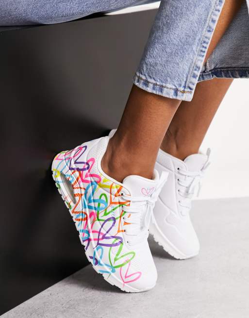 Skechers Uno sneakers with neon graffiti heart print in white