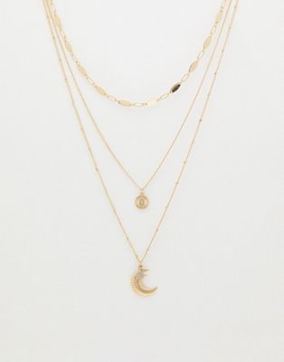 Skinny Dip layered necklace in gold with moon and star details