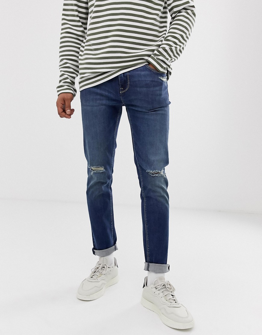 Skinny-jeans i dark wash med flænger på knæene fra ASOS DESIGN-Blå